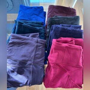A bundle of Lululemon Fast and Free tights and shorts.
